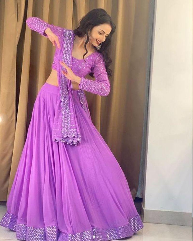 Cape style Lehenga choli, Lehenga choli in dark shades, Handloom Lehenga choli, Lehenga choli with asymmetrical hem, Lehenga choli for vacation, Lehenga choli with gold foil work, Convertible Lehenga choli, Lehenga choli with halter neck, Mirror embroidered Lehenga choli, Lehenga choli with scalloped edges